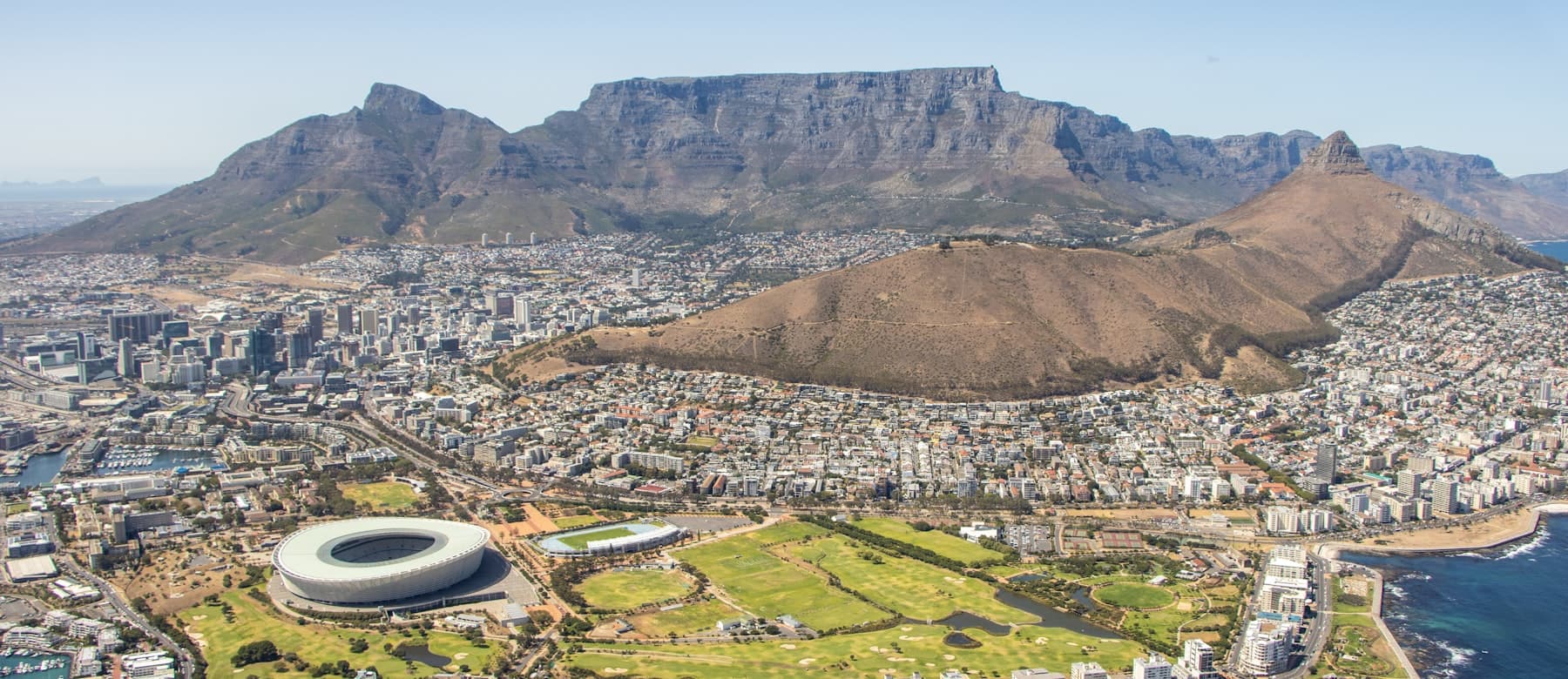 Aerial view of Cape Town with Table Mountain and Lion's Head behind the city